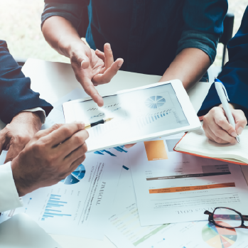 team analyzing financial charts